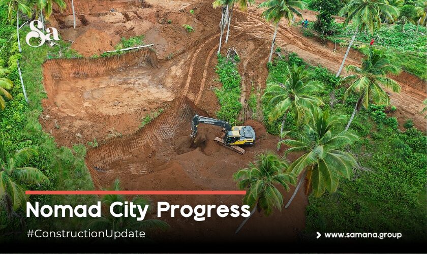 Excavator working in red earth among palms, captioned Nomad City Progress